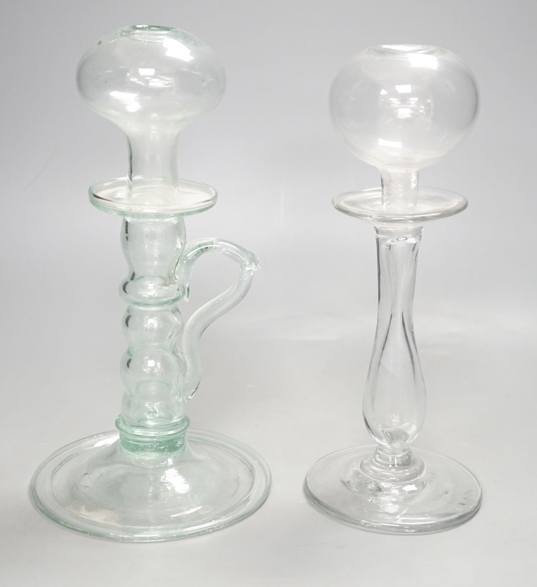 Two 19th century glass lacemaker's lamps, 25cm